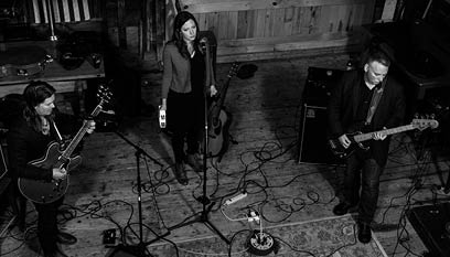 Three musicians rehearsing